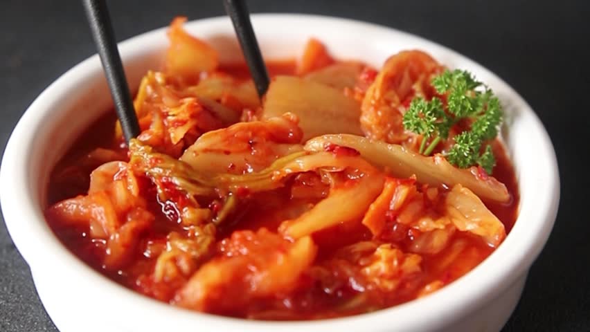 Kimchi pickled cabbage salad spicy savory vegetables fresh delicious gourmet food background on the table rustic food top view copy space vegetarian and vegan food