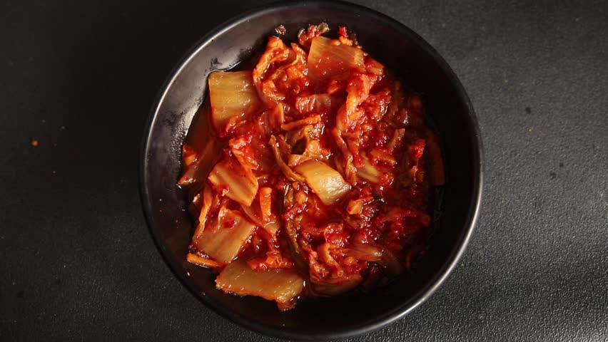 Kimchi pickled cabbage salad spicy savory vegetables fresh delicious gourmet food background on the table rustic food top view copy space vegetarian and vegan food