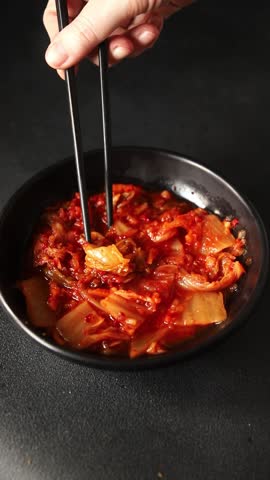 Kimchi pickled cabbage salad spicy savory vegetables fresh delicious gourmet food background on the table rustic food top view copy space vegetarian and vegan food