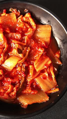 Kimchi pickled cabbage salad spicy savory vegetables fresh delicious gourmet food background on the table rustic food top view copy space vegetarian and vegan food