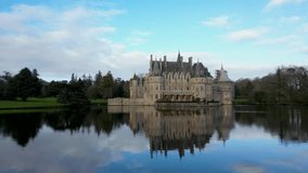 Medieval castle on the shore of a river, Chateau de la Breteshe, France, 4k - Powered by Shutterstock - Get 15% off with code: PIKWIZARD15