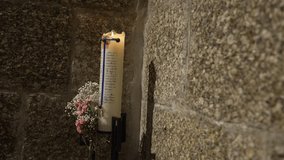burning candle with handwritten prayer beside baby’s breath and pink flowers on stone wall - Powered by Shutterstock - Get 15% off with code: PIKWIZARD15