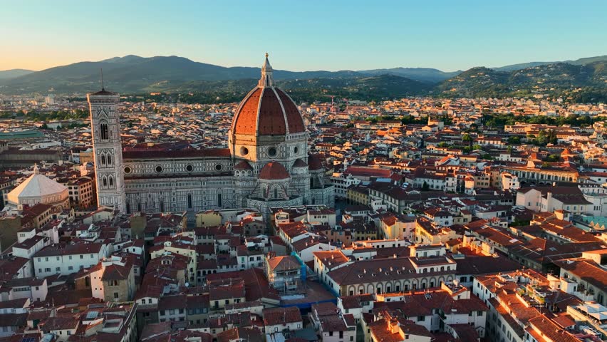 Drone view of Florence cathedral at sunset, capital of Tuscany region in Italy, Duomo Cathedral of Santa Maria del Fiore, famous renaissance Italian landmark