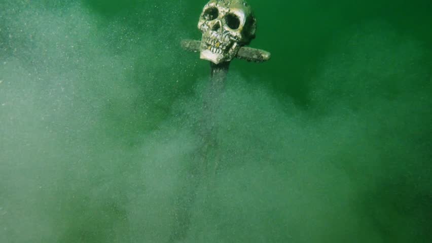 Underwater Skull Sword Emerging from Sediment