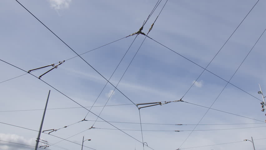 Tram Overhead Lines Against The Blue Sky In Amsterdam, Netherlands. Wide shot