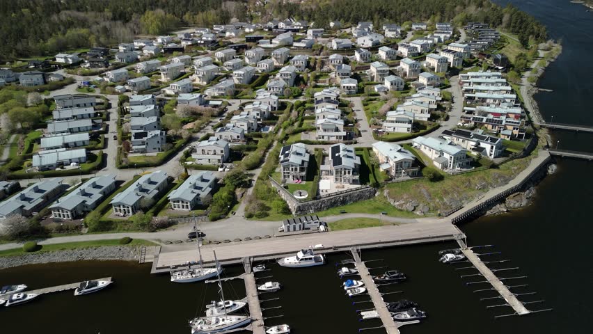Aerial twisting shot of a town in the Swedish archipelago.