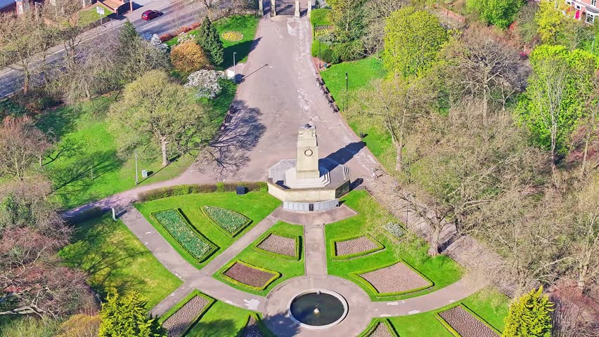 Straight down aerial of intersecting park trails, trees, and manicured grass spaces Rotherham Clifton Park War Memorial