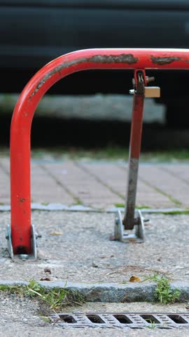 Car parking lock device. Manual car parking barrier with lock and stop sign. Guests parking dedicated