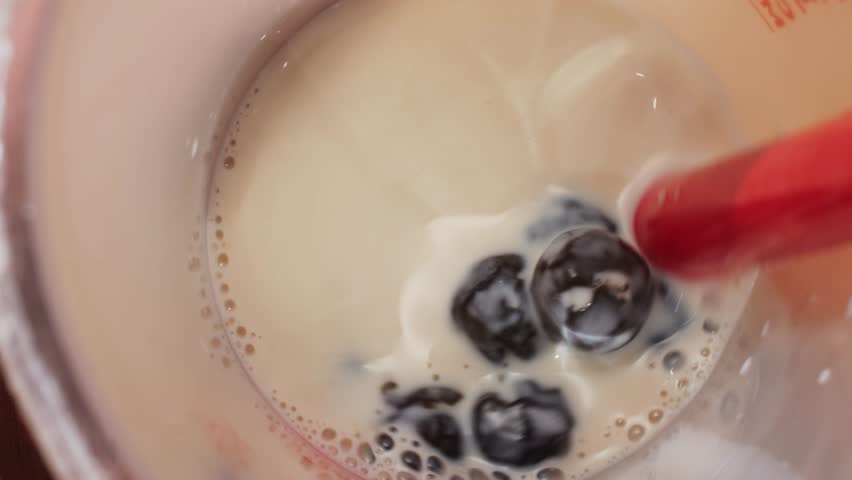 Cooking, boiling brown sugar flavor tapioca pearl balls, chinese food, ingredient of bubble tea, preparing food and drink, close up, recipe cookbook steps design concept.