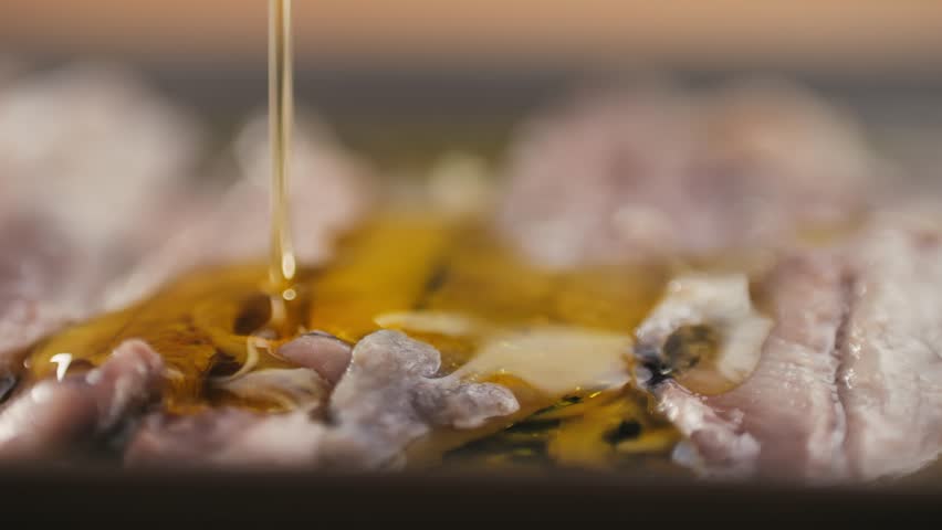 Fresh Sea sardines and Anchovy Fish and Mullus On Display On Ice On Market Store Shop. Seafood Fish Background, sprats, smelt close up stand of small salty white fish.