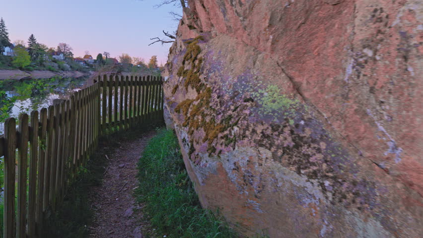  Nordic walking, first-person view, along a forest trail, along the riverbank. 