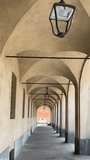 Tracking shot under 18th century Italian arcades with arched ceiling - Powered by Shutterstock - Get 15% off with code: PIKWIZARD15