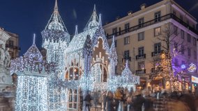 Night timelapse hyperlapse of Christmas decorations with illuminated castle on Luis de Camoes square in Lisbon, Portugal. People walking around the festive lights and historic architecture. Front view - Powered by Shutterstock - Get 15% off with code: PIKWIZARD15