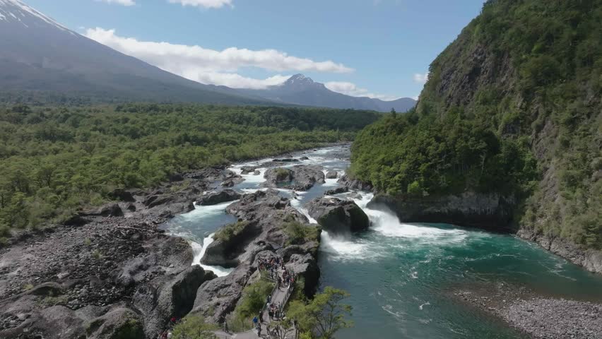 River Rapids Through Forest and Volcanic Rocks in Chile Petrohue Waterfalls