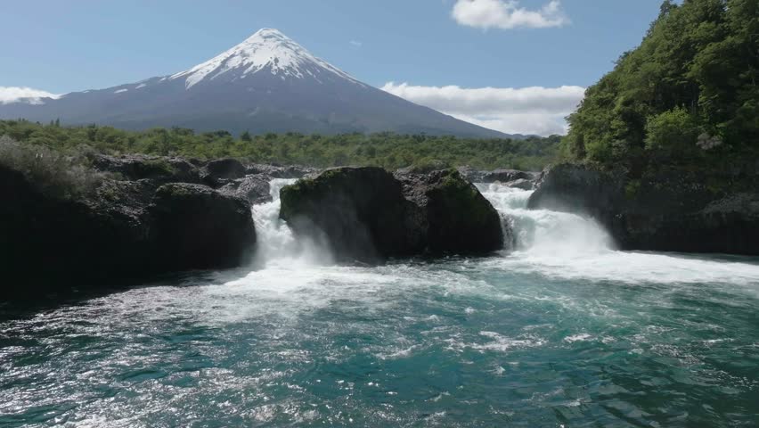 River Rapids Through Forest and Volcanic Rocks in Chile Petrohue Waterfalls