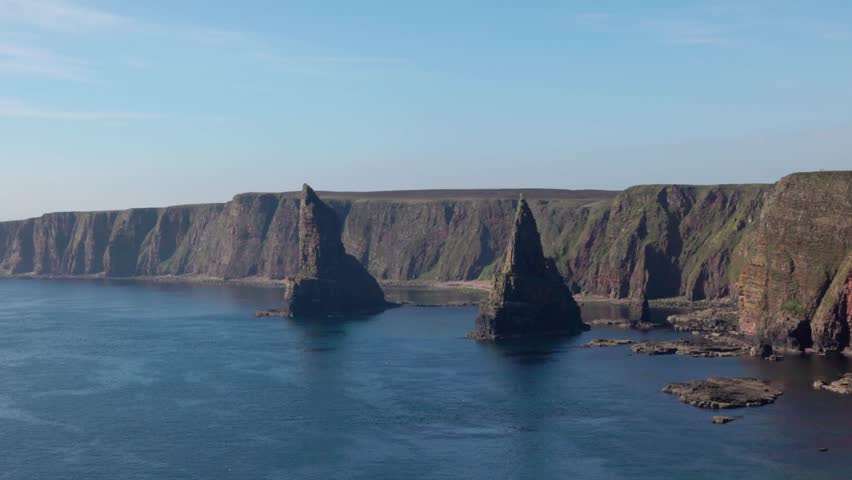 medium shot of the Duncansby sea stacks with turquoise waters near John O