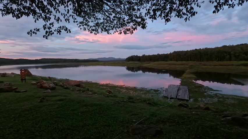 Evening riverside atmosphere, overlooking mountains and forests, slow-motion