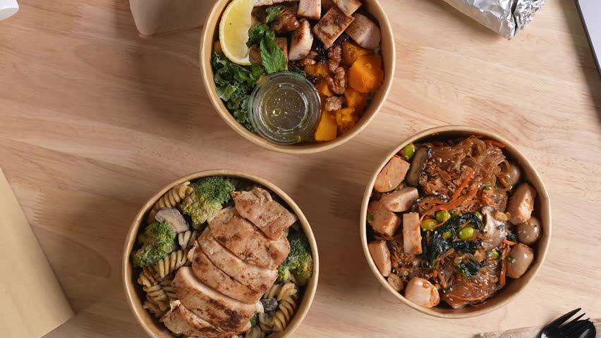 Having a lunch break at the office with delicious Healthy food delivery in take away boxes, Healthy eating concept.