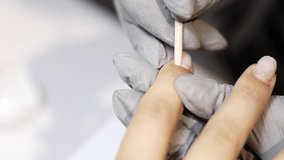 nail master applying gel polish, step by step guide.manicurist is using a nail file,drill, first,remove cuticle with nipper and push with stick.woman buffing,clean,degrease and using uv lamp. - Powered by Shutterstock - Get 15% off with code: PIKWIZARD15