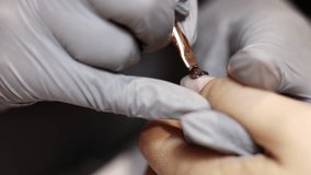 nail master applying gel polish, step by step guide.manicurist is using a nail file,drill, first,remove cuticle with nipper and push with stick.woman buffing,clean,degrease and using uv lamp. - Powered by Shutterstock - Get 15% off with code: PIKWIZARD15