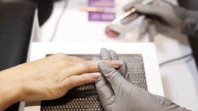 nail master applying gel polish, step by step guide.manicurist is using a nail file,drill, first,remove cuticle with nipper and push with stick.woman buffing,clean,degrease and using uv lamp. - Powered by Shutterstock - Get 15% off with code: PIKWIZARD15
