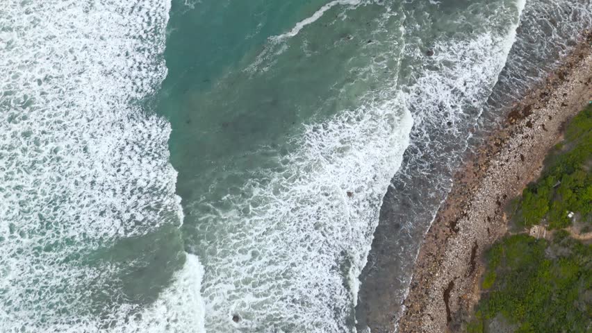 Aerial shot of Bluff Cove, Palos Verdes Estates, California on an overcast day revealing beautiful homes atop of the dramatic cliffs