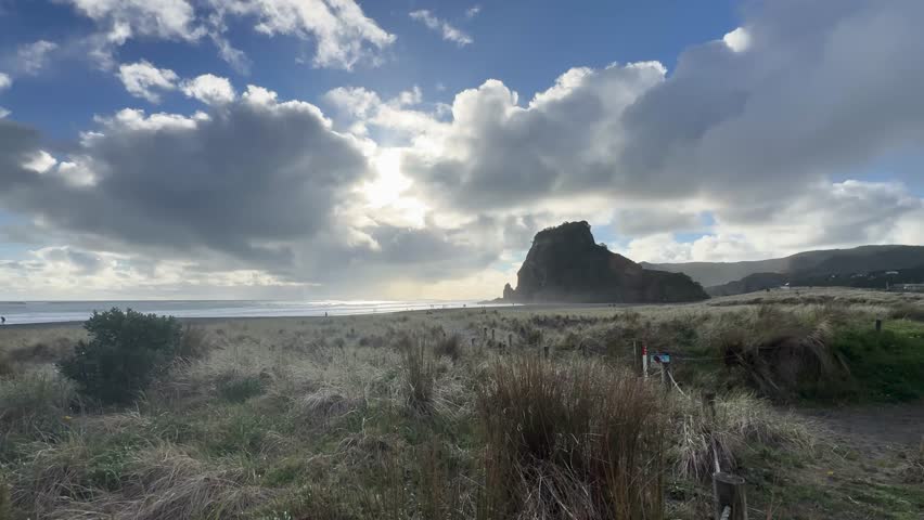 Beautiful lagoon and ocean beach in Piha, Auckland, New Zealand, before sunset.