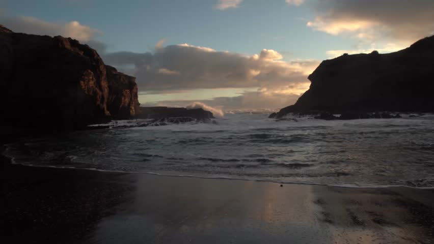 Beautiful lagoon and ocean beach in Piha, Auckland, New Zealand, before sunset.