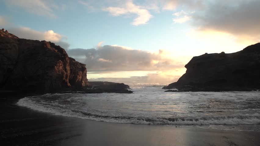 Beautiful lagoon and ocean beach in Piha, Auckland, New Zealand, before sunset.