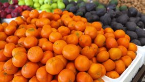 4K footage of vibrant oranges, avocados, and apples neatly stacked at a market. Fresh produce display perfect for commercials, health content, or grocery store ads. Bright, rich, and crisp visuals. - Powered by Shutterstock - Get 15% off with code: PIKWIZARD15