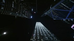 Vertical View Capturing Illuminating Skyscrapers Rising Against Dark Nighttime Sky. Hong Kong Skyscrapers At Night Seen From Below. Central Business District, Revealing Urban Architectural Grandeur - Powered by Shutterstock - Get 15% off with code: PIKWIZARD15