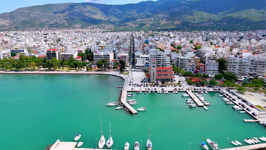 Panoramic aerial view of the cityscape of Volos, Magnesia, Greece, with Agios Konstantinos church and yacht marina