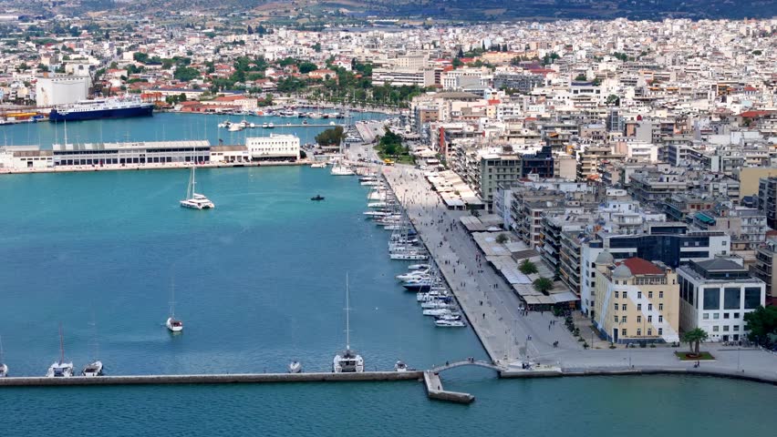 Aerial view of the cityscape of Volos, Magnesia, Greece, with sailboat marina and port promenade