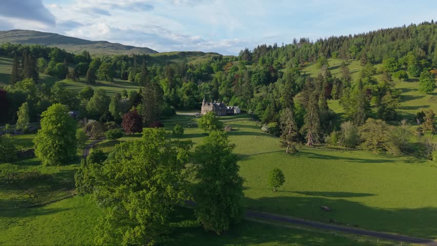 A scenic countryside house in rural UK, nestled within lush green nature—captured with soft light to highlight the peaceful landscape
