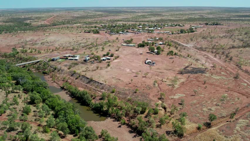 Aerial view of the Victoria River and the communtiy of Kalkarindji, Gurindji, in the background. Northern Territory, Australia, August 2022.