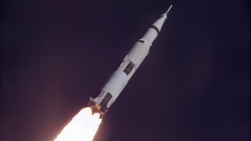 Saturn V rocket flying towards the moon.