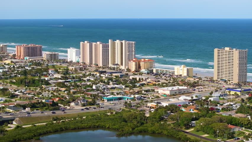 Aerial view of waterfront houses in Daytona Beach city, Florida. Coastal housing development in the USA