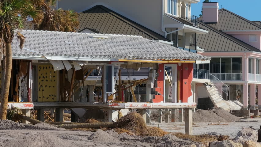 Destroyed houses on ocean coast. Hurricane Milton consequences in Englewood, Florida. Storm surge severe damage.