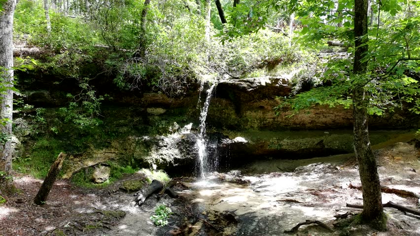 Slow pass over a small waterfall in South Carolina with dappled sunlight