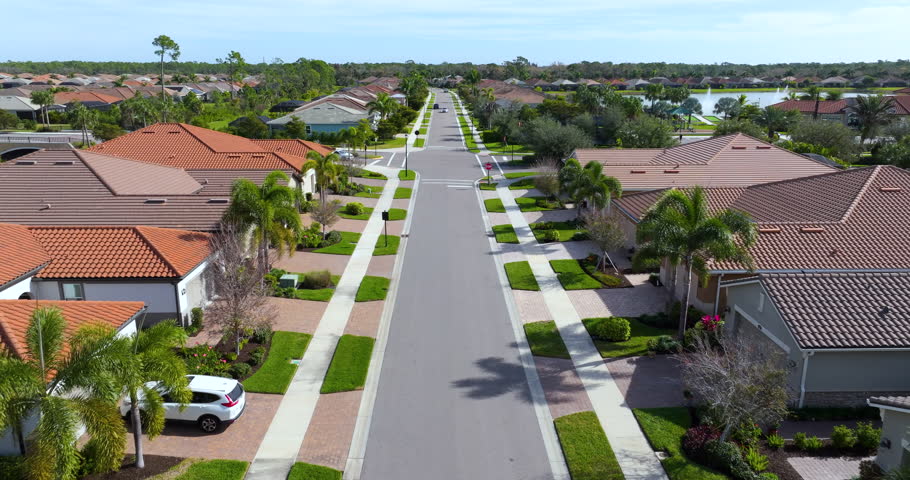 Large residential homes in southwest Florida gated community. American houses in rural US suburbs