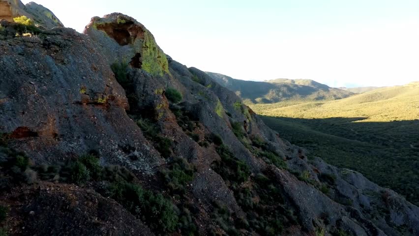 Mountainous Landscape with Rock Formations and Desert Vegetation