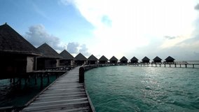 Overwater bungalows, wooden walkway, tropical resort, turquoise lagoon, idyllic scenery - Powered by Shutterstock - Get 15% off with code: PIKWIZARD15