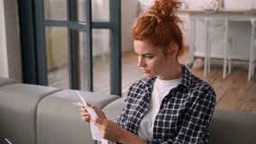 Caucasian woman at home girl female at home with laptop online payment banking checking check financial income finance receipt payments personal budget puzzled difficult problem debt loan mortgage - Powered by Shutterstock - Get 15% off with code: PIKWIZARD15