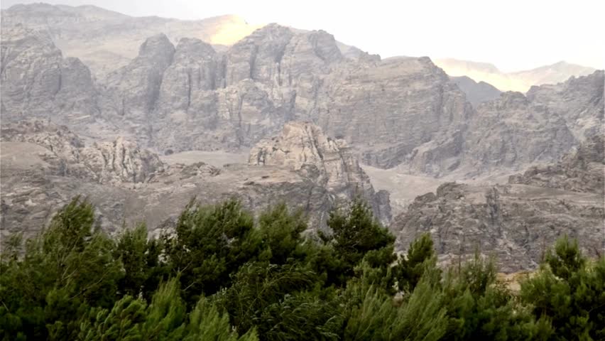 Majestic Mountain Range Landscape with Evergreen Trees in Foreground