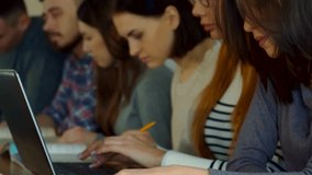 Engaging female student turns her face towards the camera in a lecture hall - Powered by Shutterstock - Get 15% off with code: PIKWIZARD15