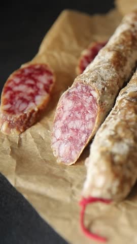 Dry-cured sausage pork meat smoked food fresh delicious gourmet food background on the table rustic food top view copy space