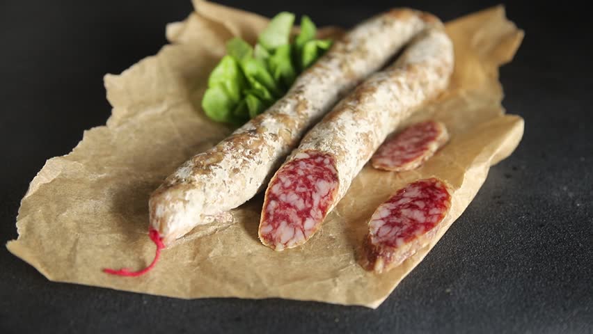 Dry-cured sausage pork meat smoked food fresh delicious gourmet food background on the table rustic food top view copy space