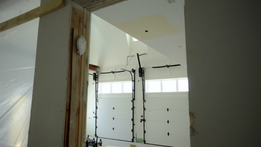 Closed double garage Doors. Shot footage Inside the garage . Move camera