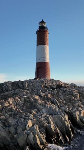 Ushuaia Lighthouse At Ushuaia In Tierra Del Fuego Argentina. Amazing Bay Water. Maritime Excursion. Boat Sailing Scene. Ushuaia Lighthouse At Ushuaia In Tierra Del Fuego Argentina.