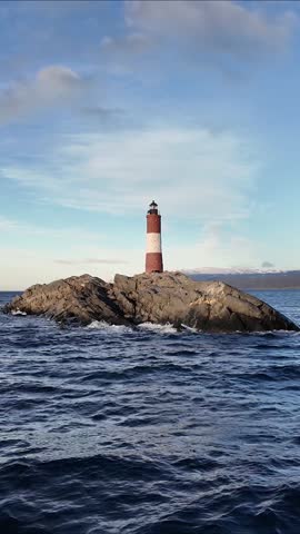 Ushuaia Lighthouse At Ushuaia In Tierra Del Fuego Argentina. Amazing Bay Water. Maritime Excursion. Boat Sailing Scene. Ushuaia Lighthouse At Ushuaia In Tierra Del Fuego Argentina.